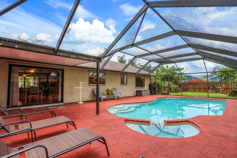 1258 Southeast Rickenbacker Terrace Port St. Lucie, FL 34952 - Photo 24 of 29 an outdoor space with pool and furniture