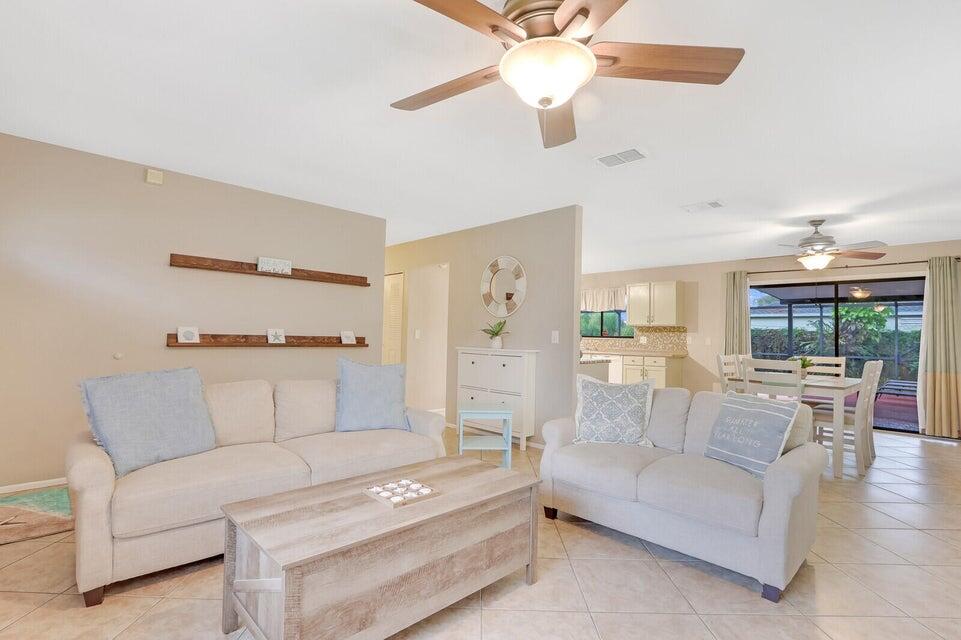 1258 Southeast Rickenbacker Terrace Port St. Lucie, FL 34952 - Photo 3 of 29 a living room with furniture and a large window