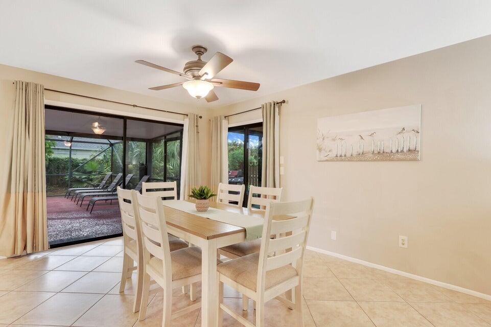 1258 Southeast Rickenbacker Terrace Port St. Lucie, FL 34952 - Photo 5 of 29 a view of a dining room with furniture window and outside view