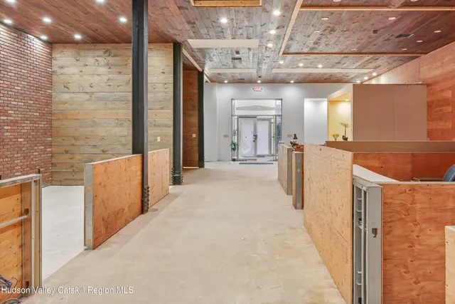 a spacious bathroom with a tub sink and mirror