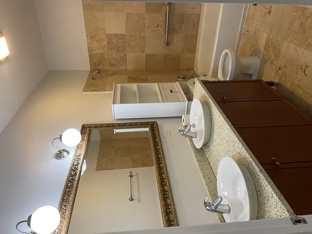 a bathroom with a sink and mirror