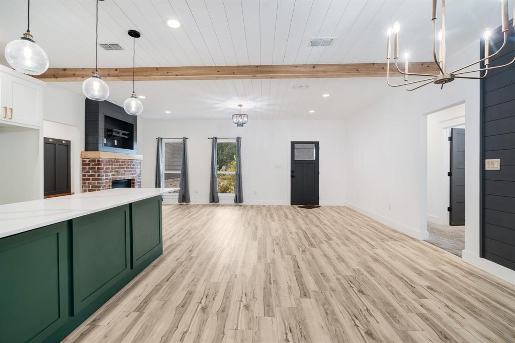 147 County Road Powderly, TX 75473 - Photo 14 of 14 a kitchen with stainless steel appliances granite countertop a refrigerator a oven and a wooden floors