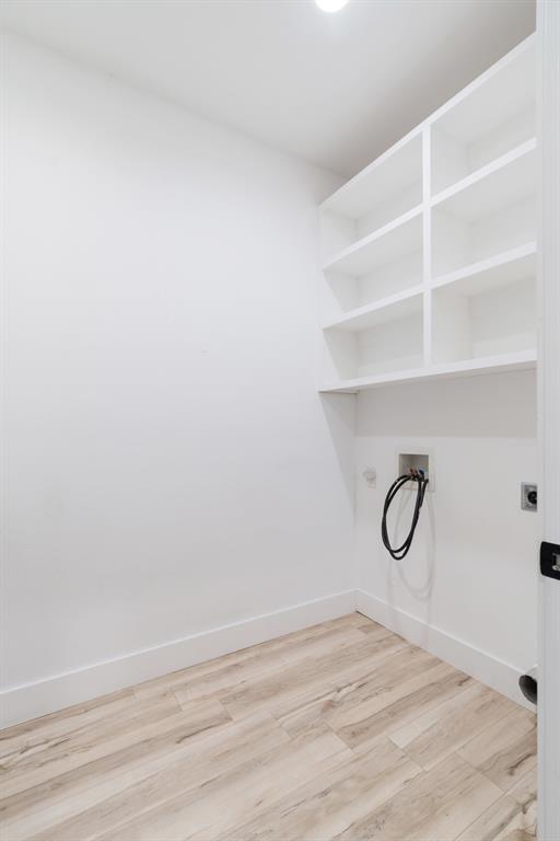 147 County Road Powderly, TX 75473 - Photo 7 of 14 a view of a room with racks on the wall