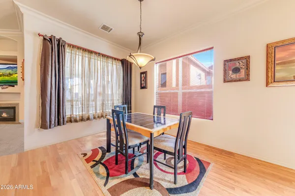 a dining room with furniture and window