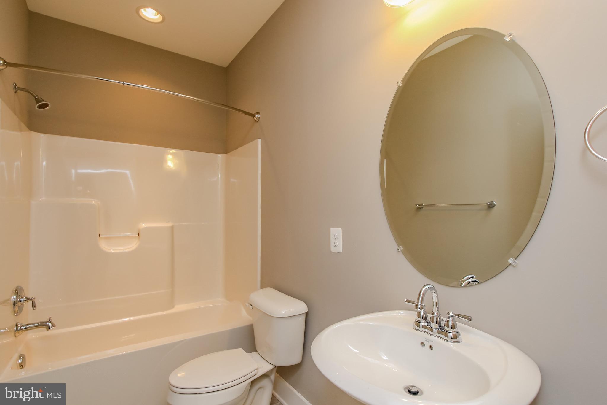6346 Zittlestown Road Boonsboro, MD 21713 - Photo 12 of 27 a bathroom with a sink toilet and shower
