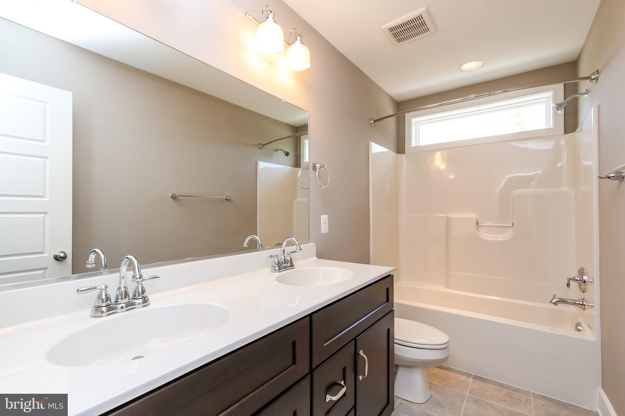 6346 Zittlestown Road Boonsboro, MD 21713 - Photo 25 of 27 a bathroom with a sink a toilet and shower