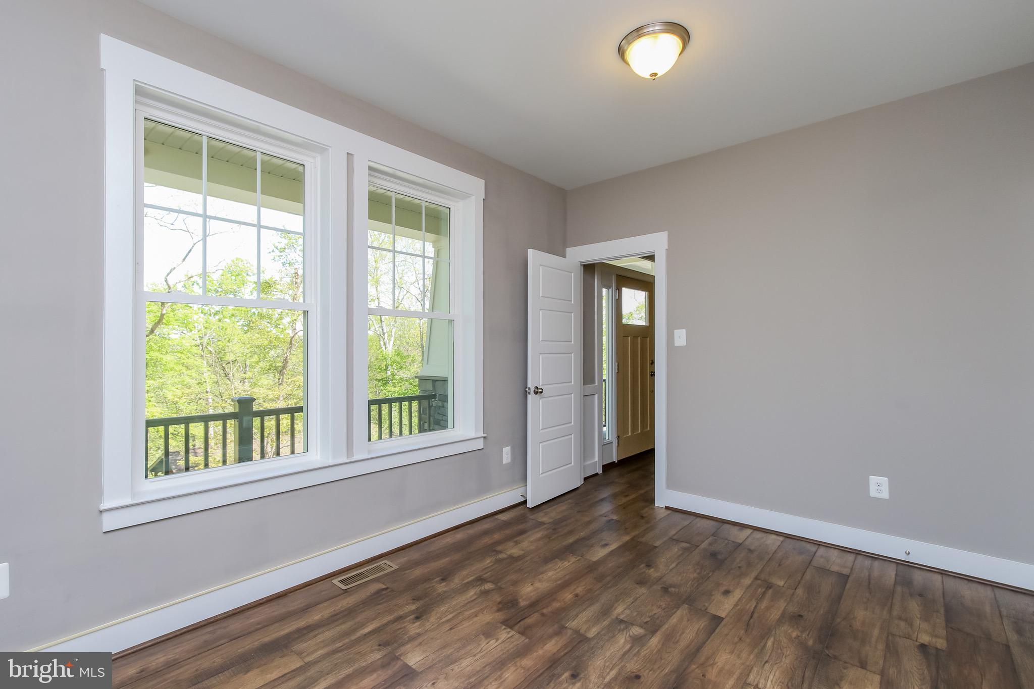 6346 Zittlestown Road Boonsboro, MD 21713 - Photo 5 of 27 an empty room with windows and closet