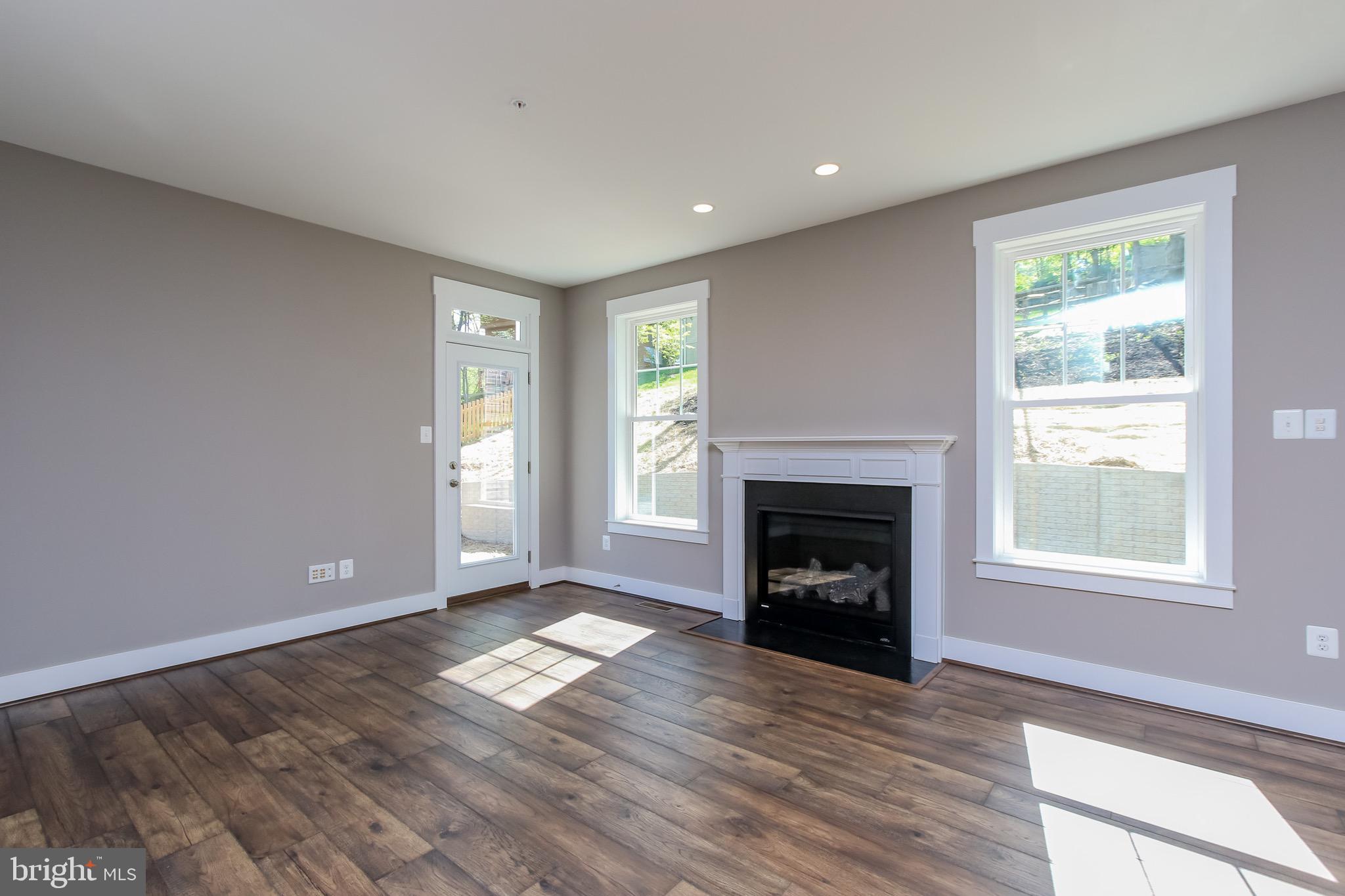 6346 Zittlestown Road Boonsboro, MD 21713 - Photo 10 of 27 a view of an empty room with window and fire place
