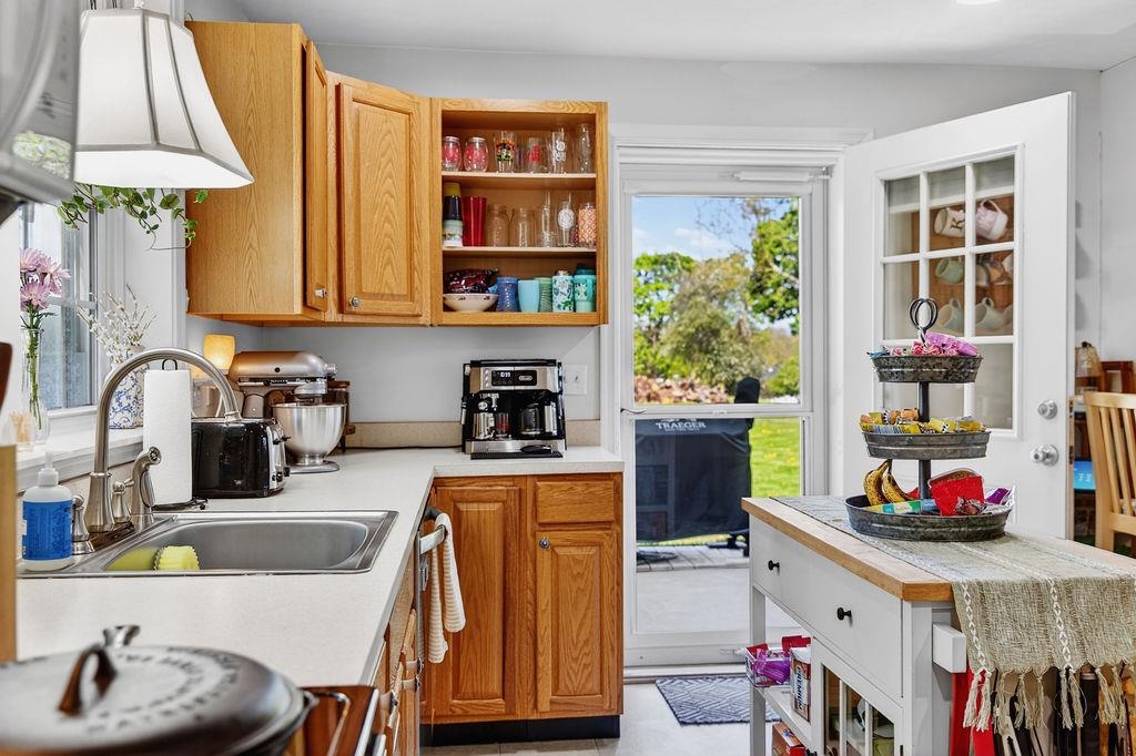 18 Bartley Street Staunton, VA 24401 - Photo 27 of 52 a kitchen with stainless steel appliances a sink a stove and a wooden floor