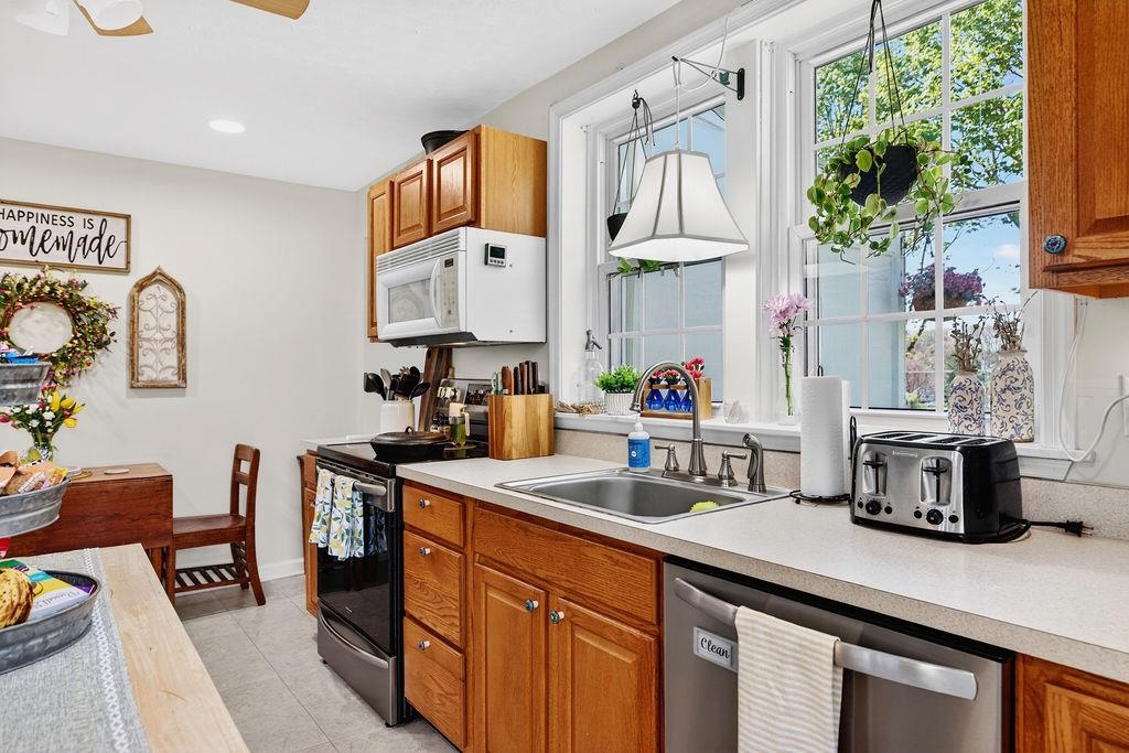 18 Bartley Street Staunton, VA 24401 - Photo 28 of 52 a kitchen with stainless steel appliances a sink a counter space and a window