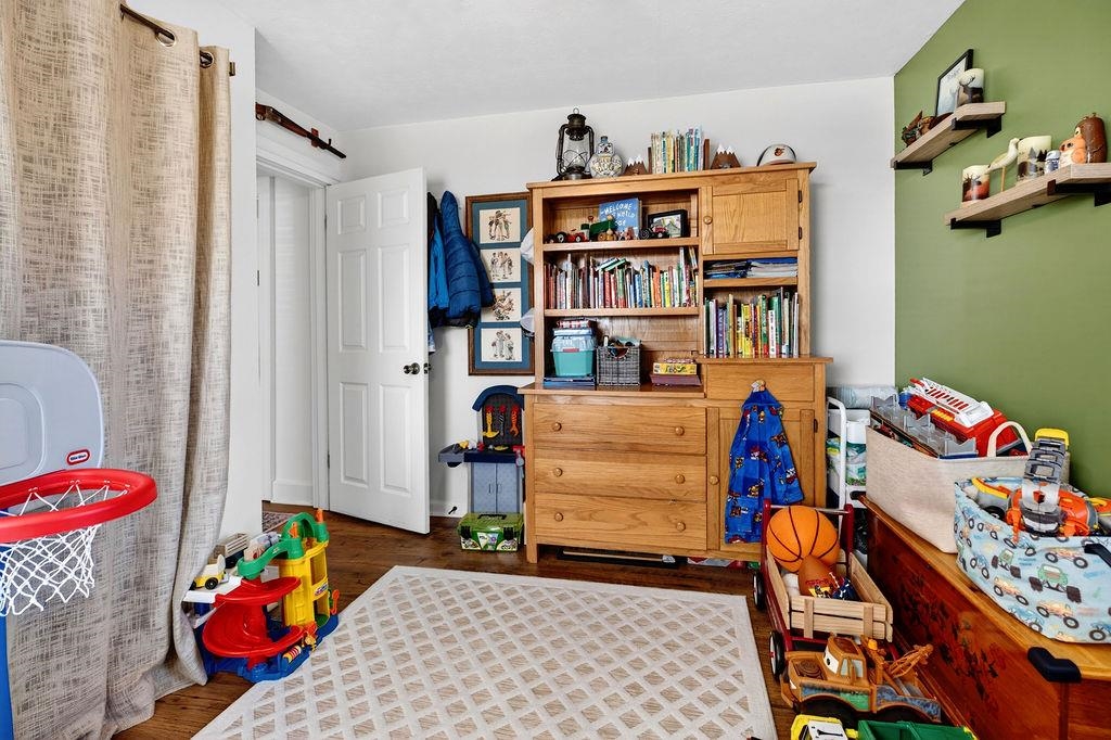 18 Bartley Street Staunton, VA 24401 - Photo 34 of 52 a bedroom with furniture and a book shelf