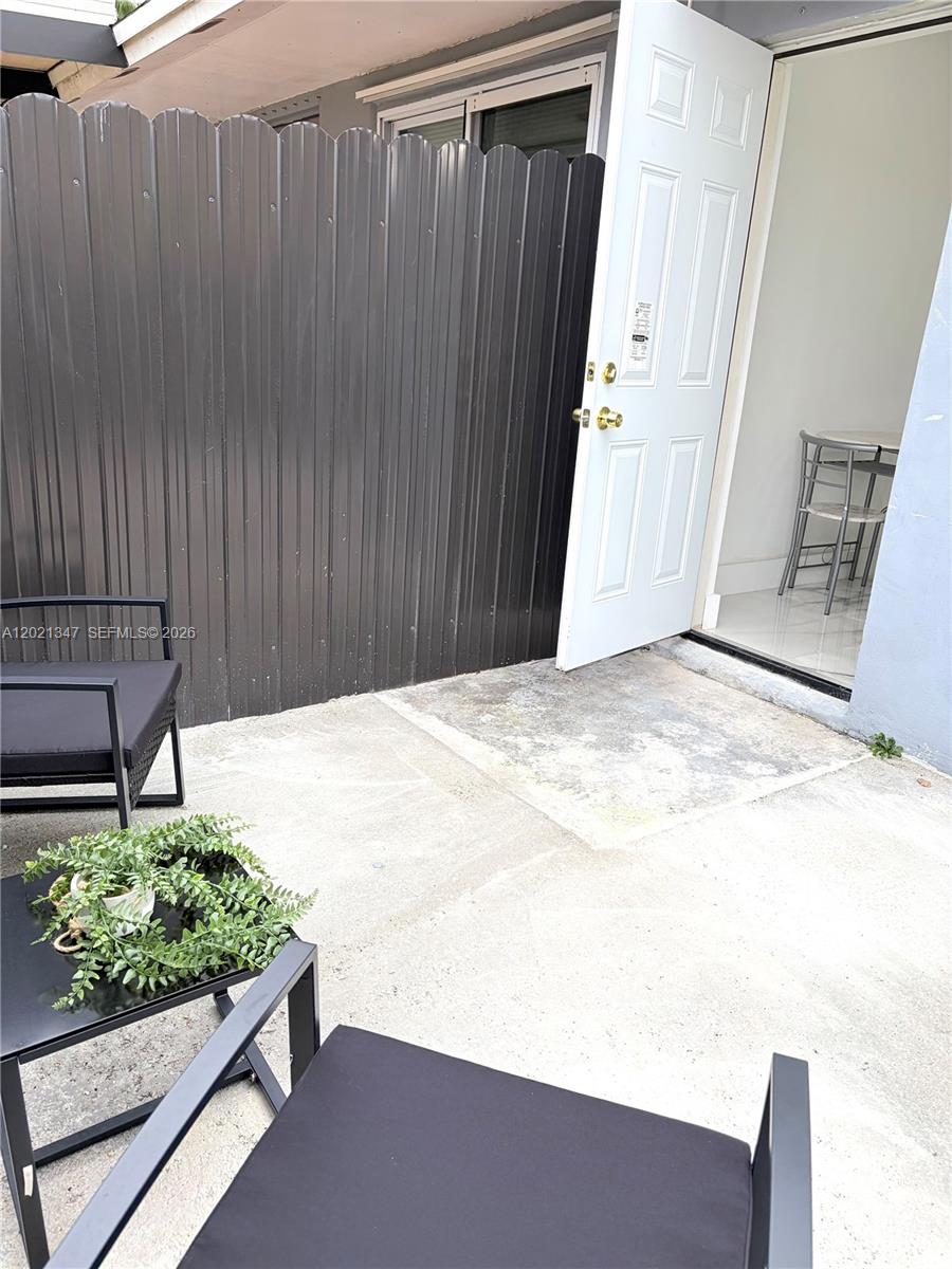 13065 Southwest 263rd Terrace, Unit 2 Homestead, FL 33032 - Photo 5 of 15 a view of a backyard
