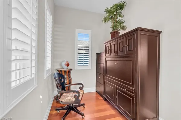 a bathroom with a sink a vanity and a mirror