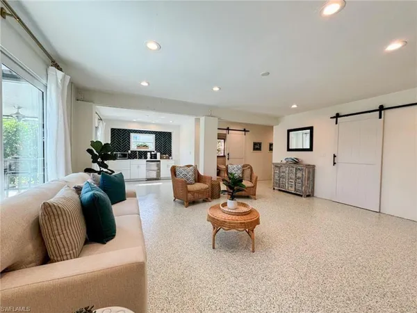 a living room with furniture and a couch