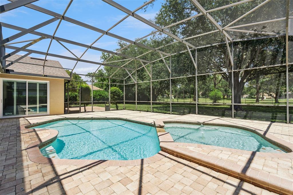 2230 Ridgewind Way Windermere, FL 34786 - Photo 31 of 38 a view of a backyard with a swimming pool