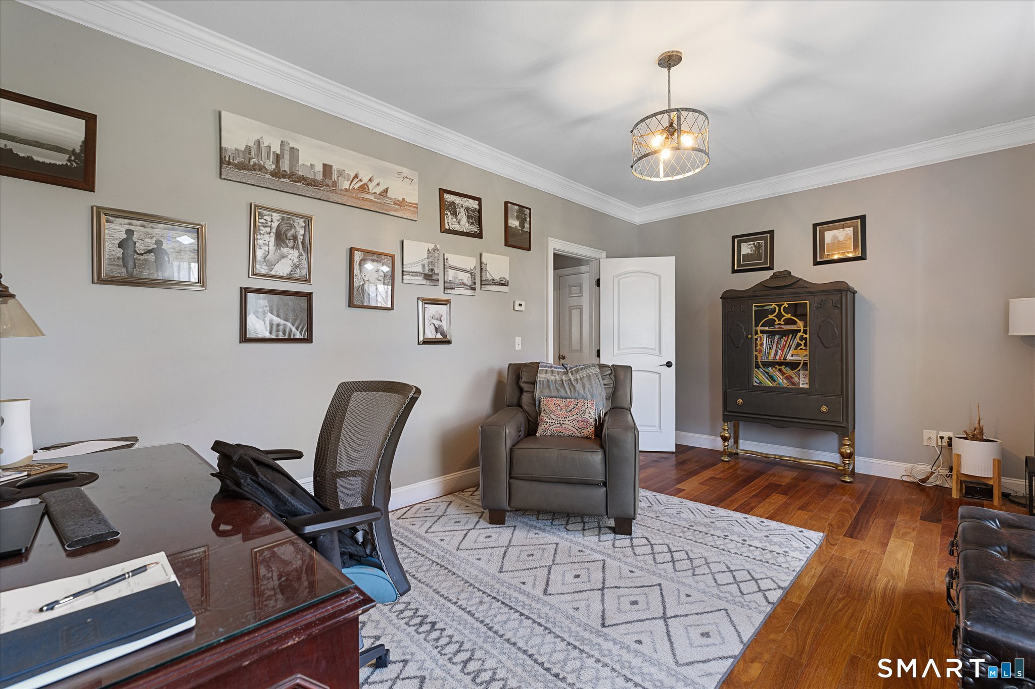 316 Allen Hill Road Brooklyn, CT 06234 - Photo 18 of 40 a living room with furniture and a chandelier