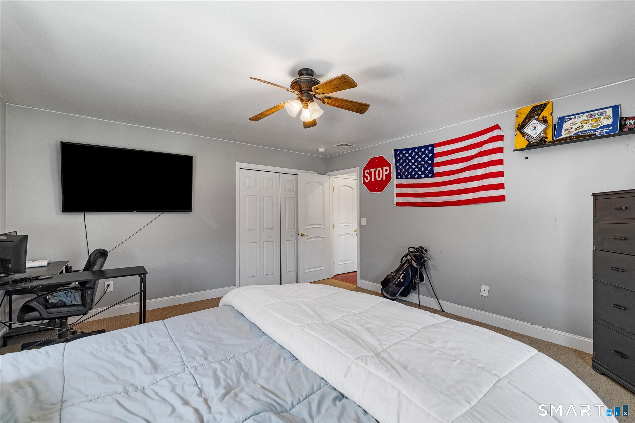 316 Allen Hill Road Brooklyn, CT 06234 - Photo 33 of 40 a bedroom with a bed and a flat screen tv