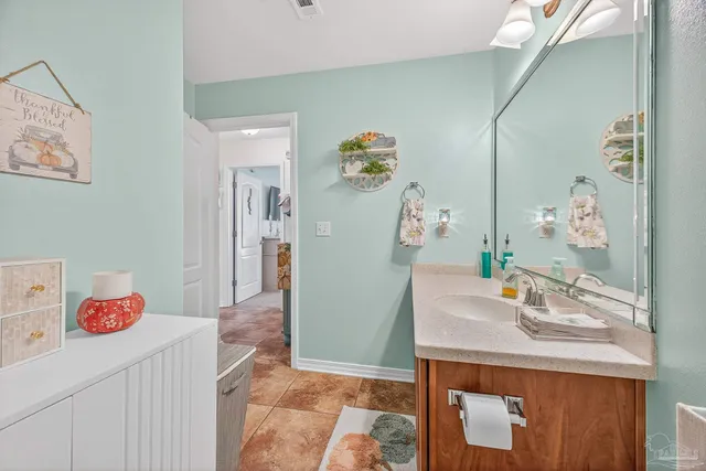 a bedroom with a bed and ceiling fan