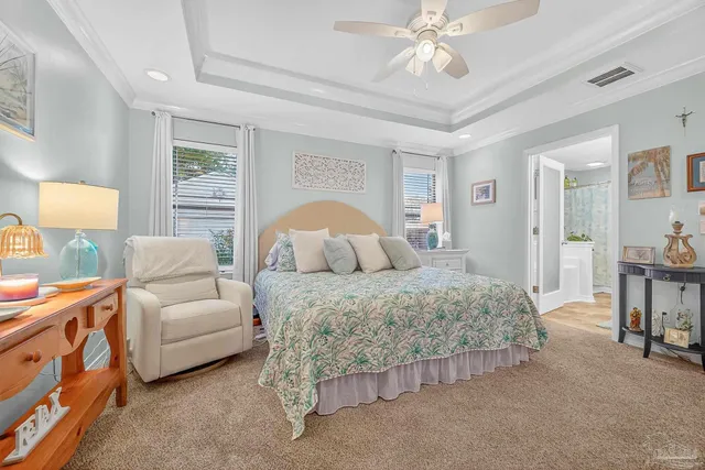 a bedroom with a bed and flat screen tv