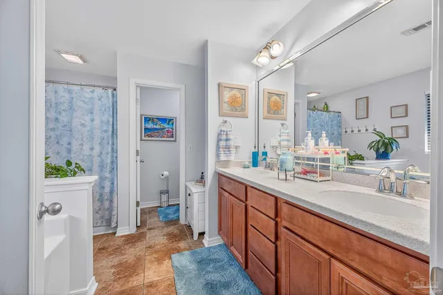 a bathroom with a bathtub a sink and a window