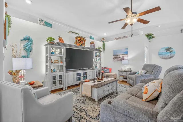 a living room with furniture and a flat screen tv