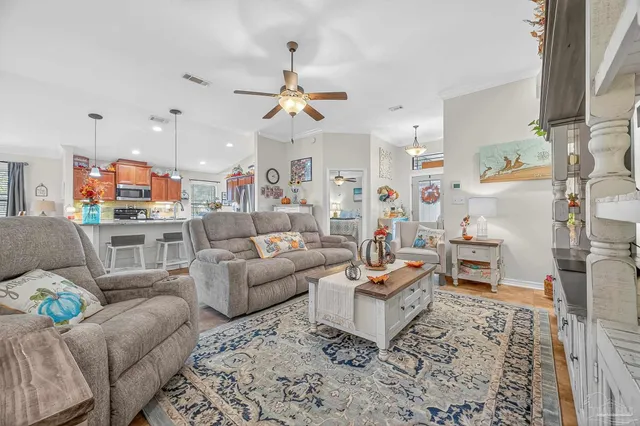 a kitchen with stainless steel appliances granite countertop a sink refrigerator and cabinets