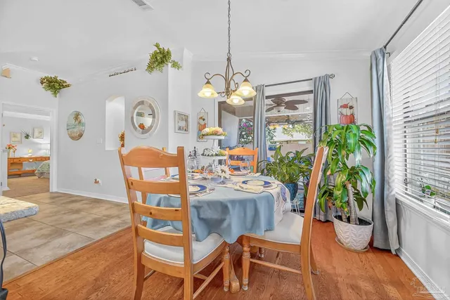 a view of a hallway with painting on the wall