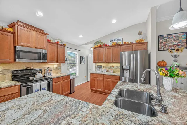 an outdoor living area with furniture and a fireplace