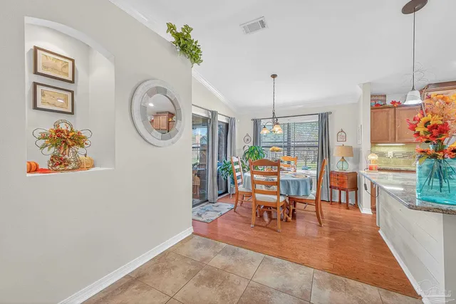 a front view of house with a garden and patio