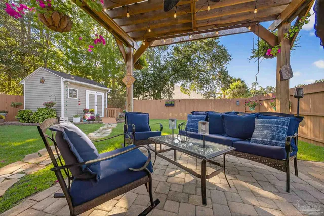 a view of a house with a yard porch and sitting area