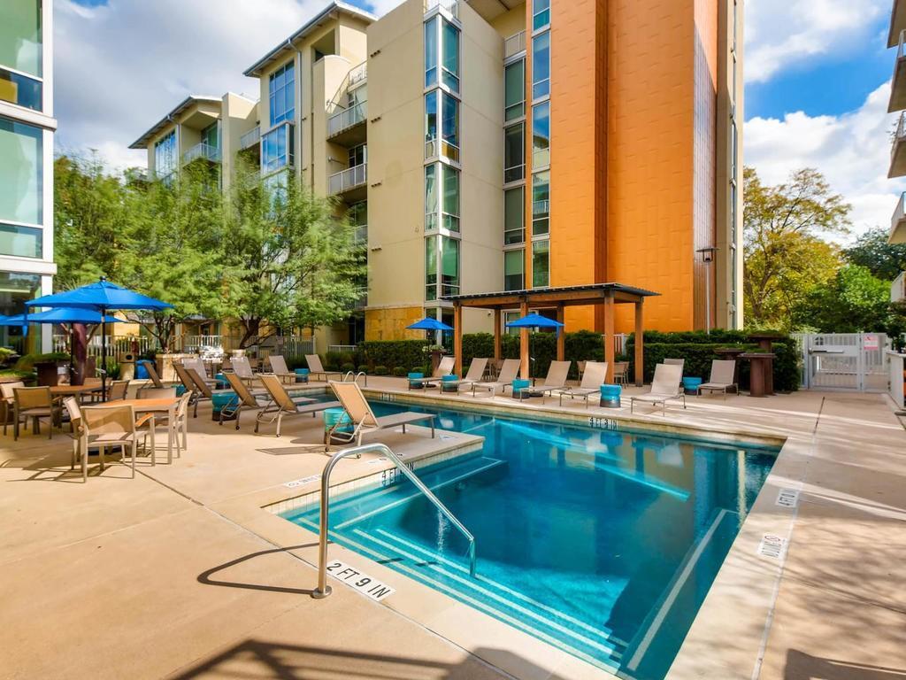1600 Barton Springs Road, Unit 5208 Austin, TX 78704 - Photo 11 of 11 a view of a swimming pool with chairs