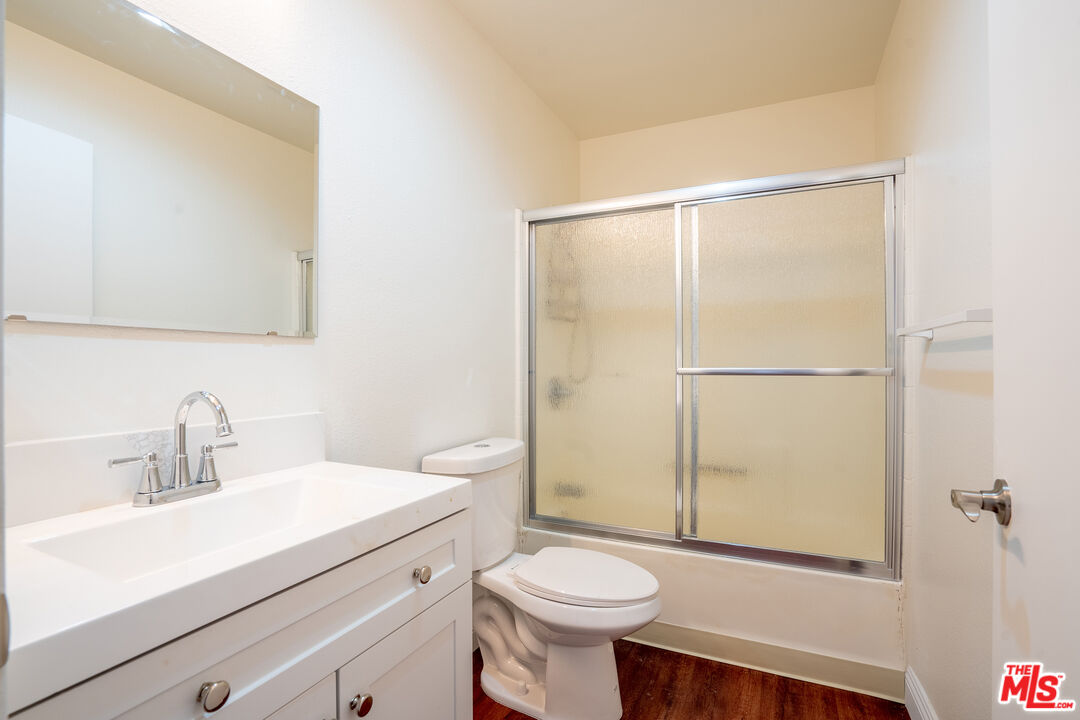 820 South St Andrews Place, Unit 304 Los Angeles, CA 90005 - Photo 11 of 16 a bathroom with a sink a toilet and shower