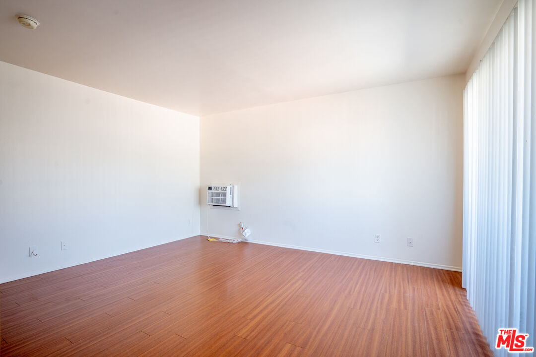 820 South St Andrews Place, Unit 304 Los Angeles, CA 90005 - Photo 14 of 16 a view of a room with wooden floor