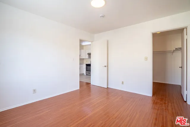 an empty room with wooden floor