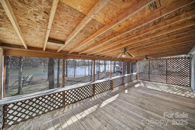 a view of a porch with wooden floor