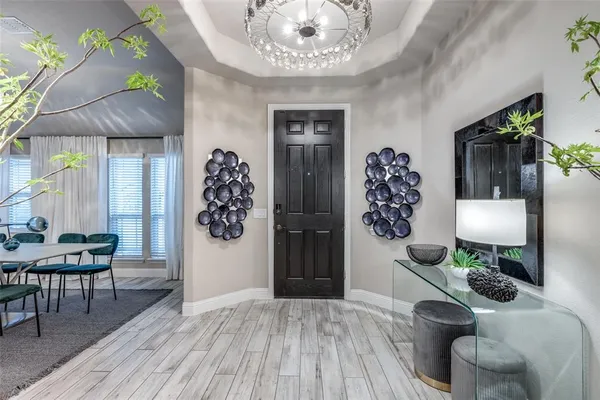 a view of living room with furniture and wooden floor