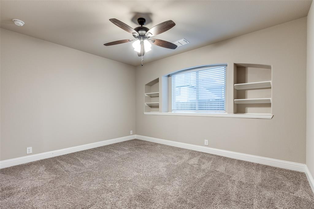 1605 George Lane Little Elm, TX 75068 - Photo 19 of 25 an empty room with windows and fan