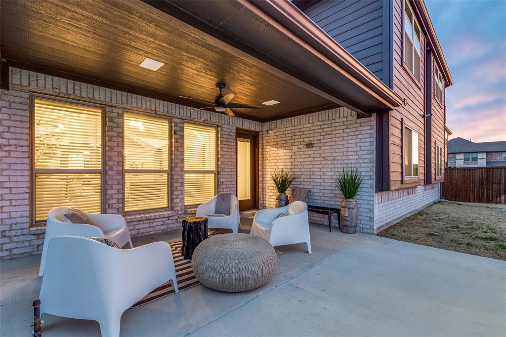 1605 George Lane Little Elm, TX 75068 - Photo 24 of 25 a living room with furniture and a fireplace