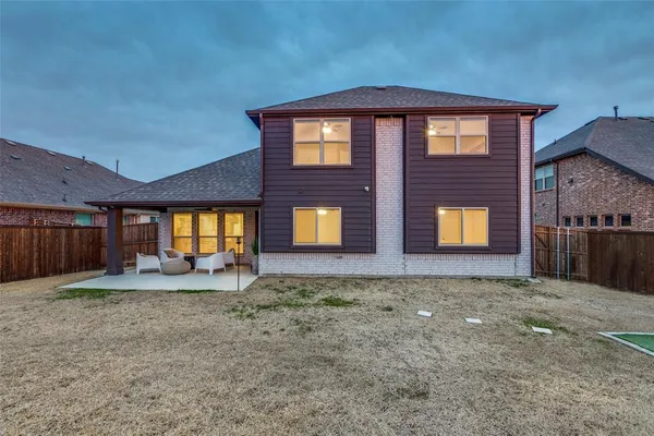 a view of a house with backyard and entertaining space
