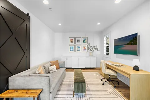 a bathroom with a sink a faucet a potted plant and a shower