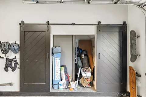 a dining hall with furniture and a floor to ceiling window