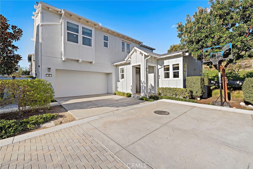 48 Jarano Street Rancho Mission Viejo, CA 92694 - Photo 56 of 75 a front view of a house with a yard and garage