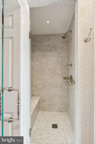 an aerial view of a residential houses with outdoor space and a lake view