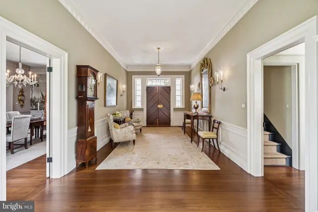 a bedroom with furniture a flat screen tv and a fireplace