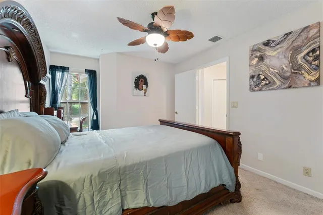 a view of a house with a yard and porch