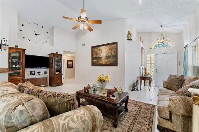 a living room with lots of furniture and white walls