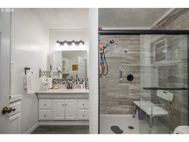 a kitchen with cabinets and window