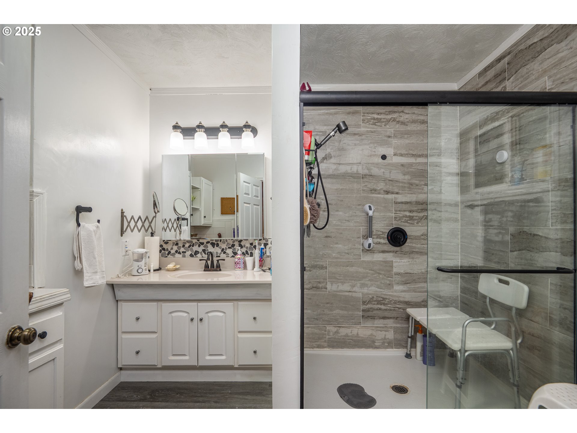 87250 Cedar Flat Road Springfield, OR 97478 - Photo 19 of 48 a bathroom with a sink mirror and shower