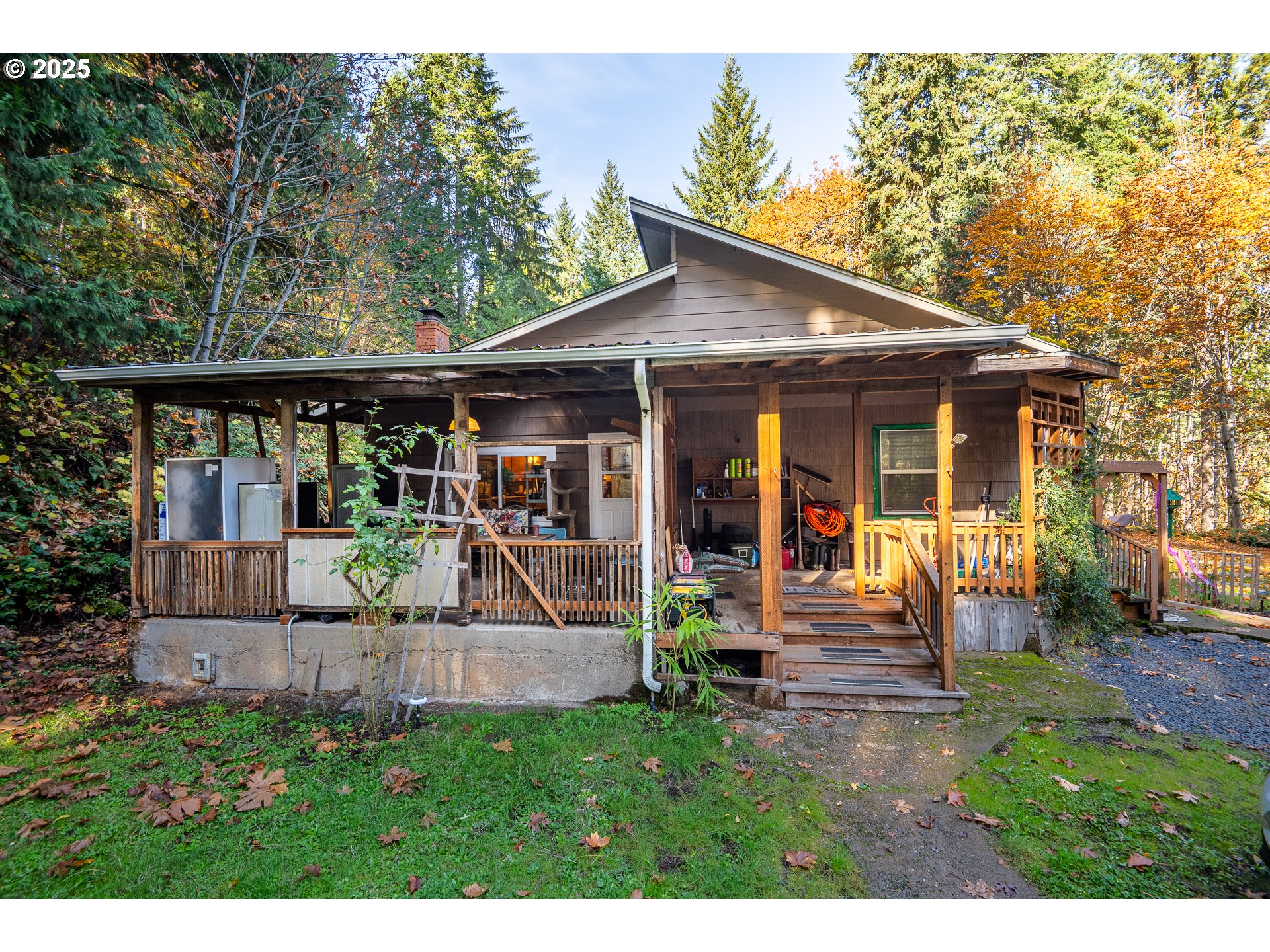 87250 Cedar Flat Road Springfield, OR 97478 - Photo 30 of 48 a view of house with a yard potted plants and a bench