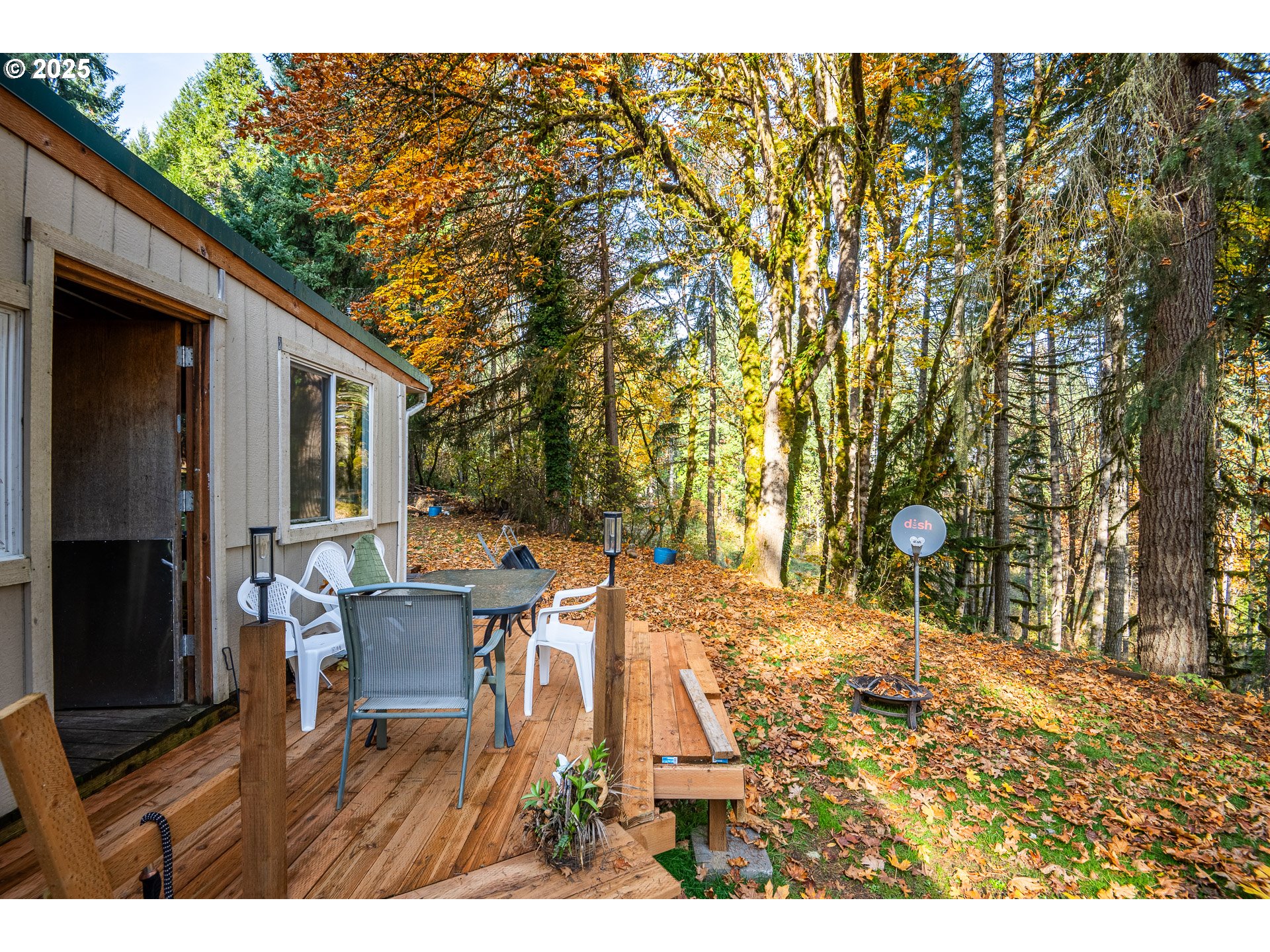 87250 Cedar Flat Road Springfield, OR 97478 - Photo 35 of 48 a view of a patio with table and chairs and wooden floor